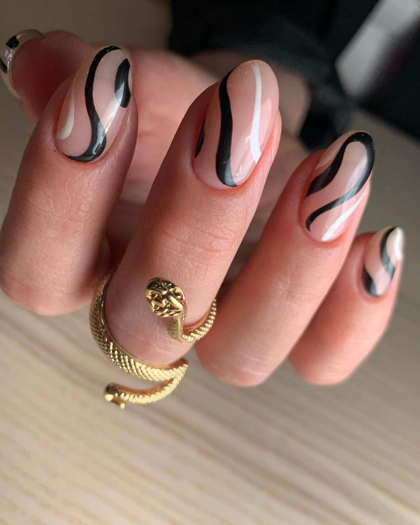 A black and white swirl nail design