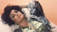 elizabeth taylor reclining on a sofa