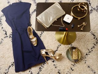 A travel bag - including metallic gold Michael Kors heels