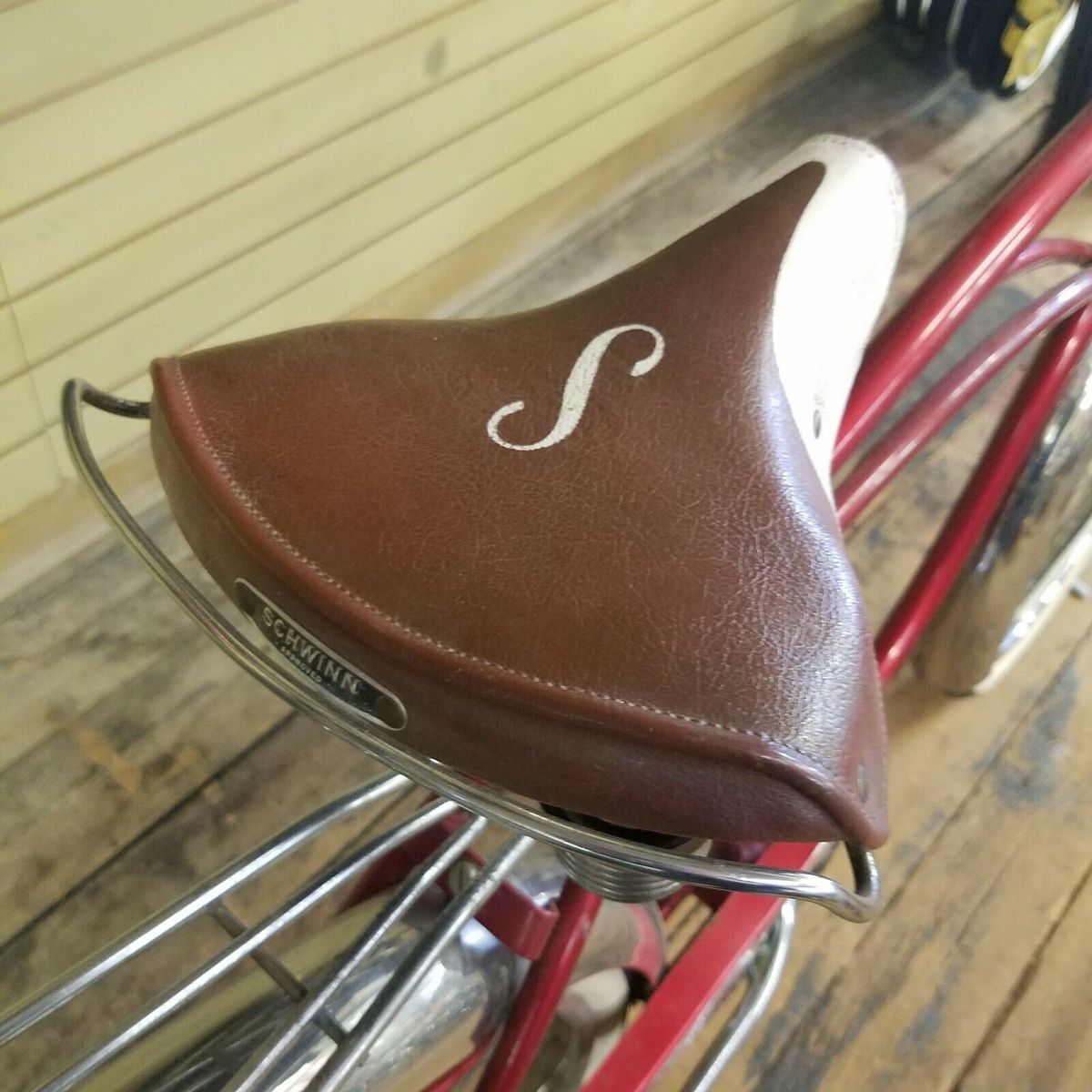 The bike's sprung-leather, Schwinn-branded saddle