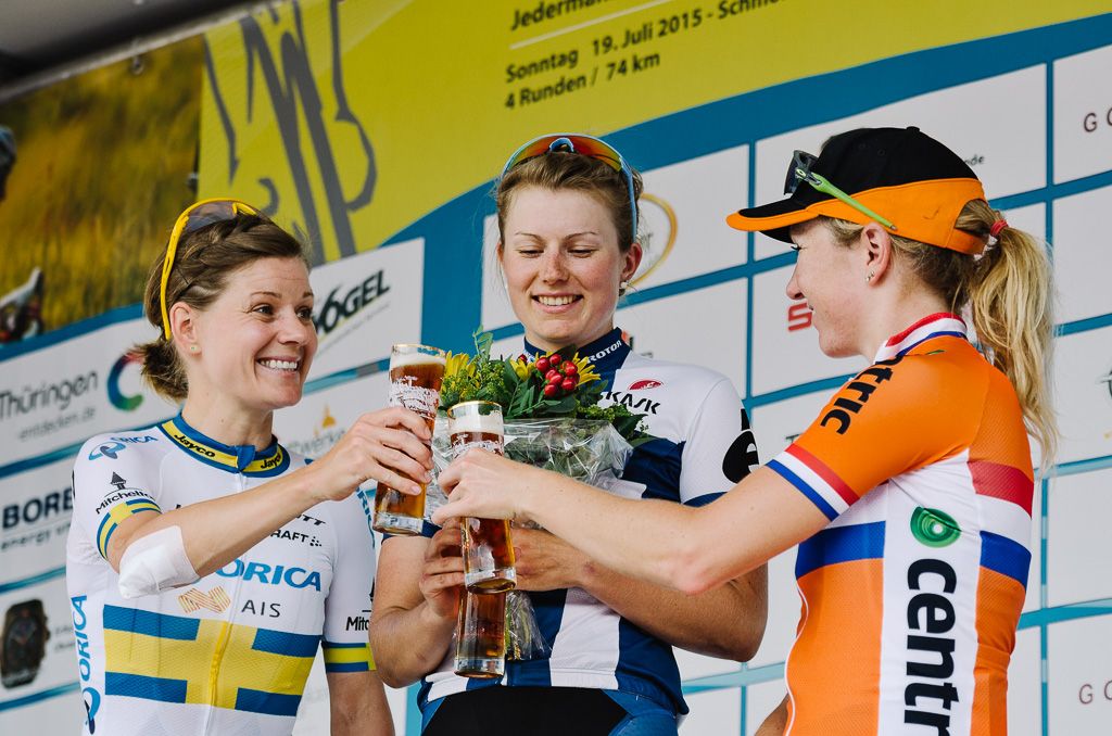 Lotta Lepist&ouml; celebrates her stage win with runners up Emma Johansson and Amy Pieters