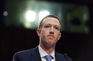 Facebook CEO Mark Zuckerberg frowns during a hearing at the Hart Senate Office Building on Tuesday, April 10, 2018, in Washington, D.C. 