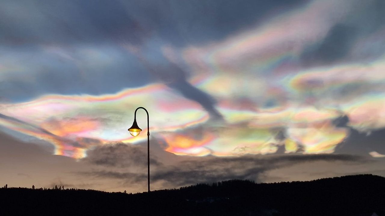 Iridescent, rainbow-colored clouds in the sky
