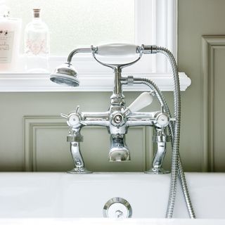 bathroom with shower mixer tap and bathtub