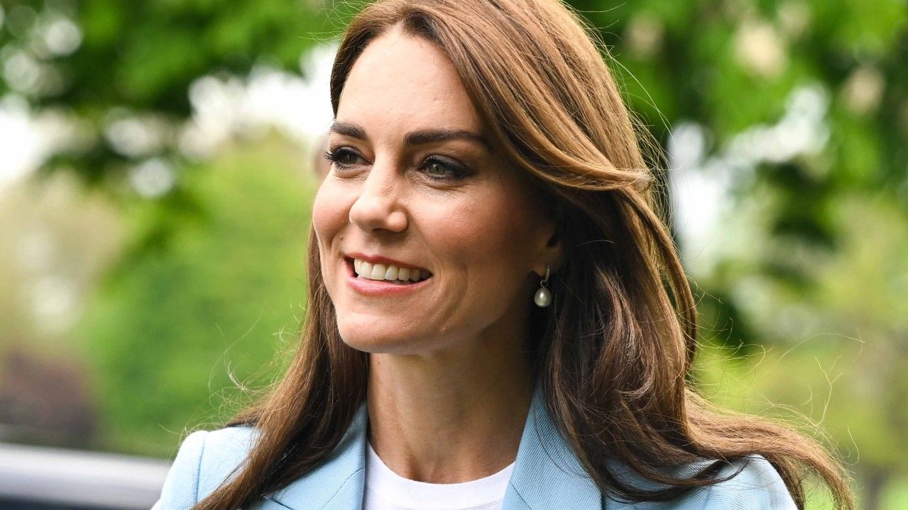 Kate Middleton wearing a blue suit