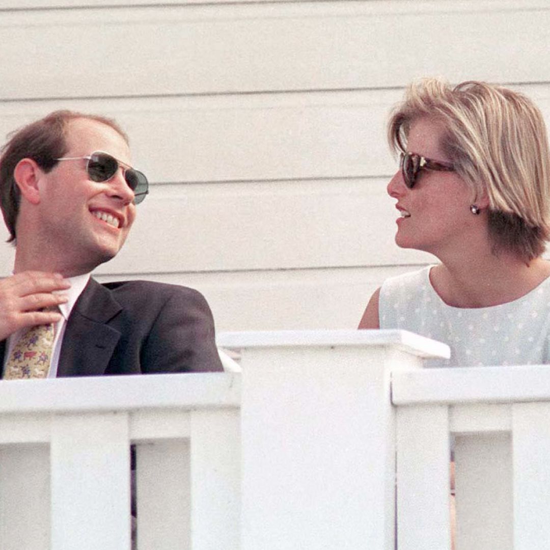 Prince Edward and Sophie Rhys-Jones sitting in front of a white railing
