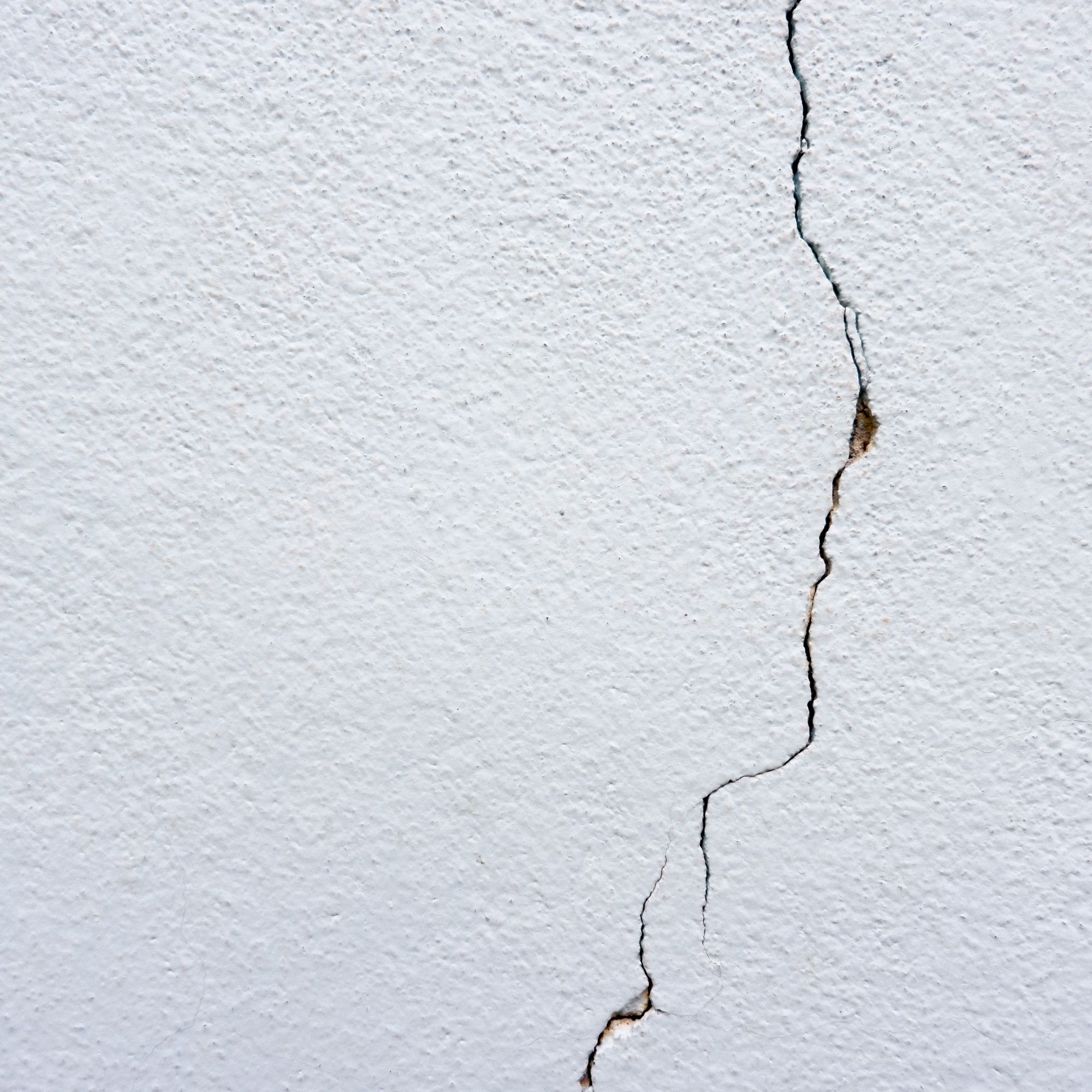 vertical crack in a plastered wall
