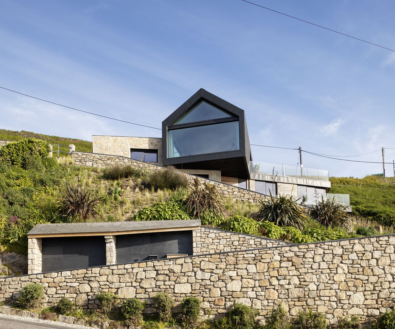 A contemporary home built on a cliffside