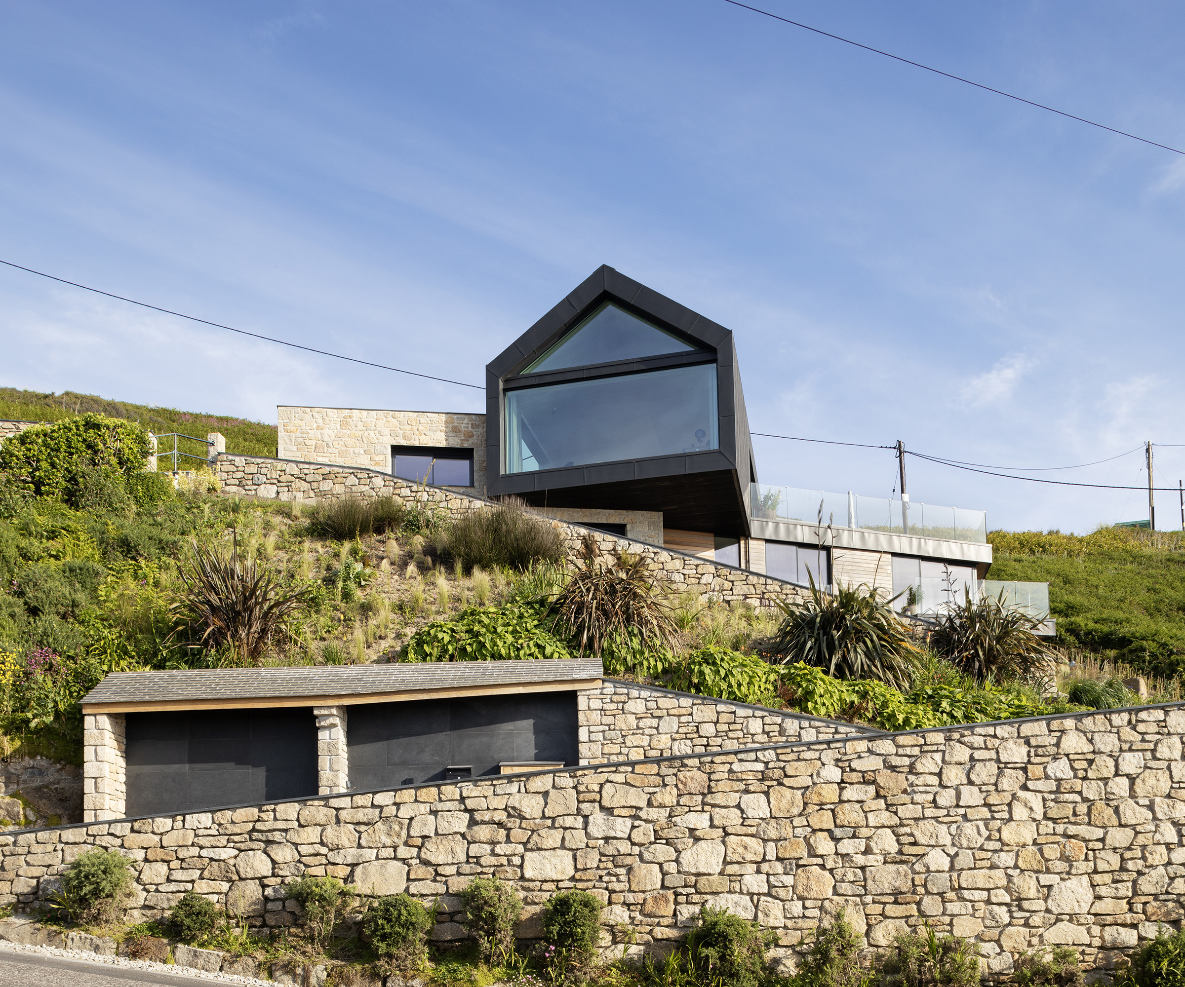 A contemporary home built on a cliffside 