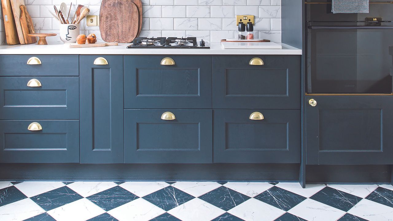 Black shaker kitchen with checkerboard flooring