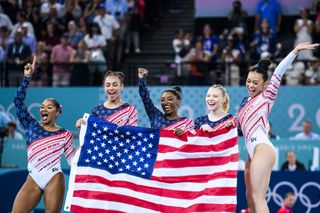 Jade Carey, Sunisa Lee, Simone Biles, Jordan Chiles and Hezly Rivera of Team USA celebrate their gold medal win in the artistic gymnastics women's team final at the Olympic Games Paris 2024.