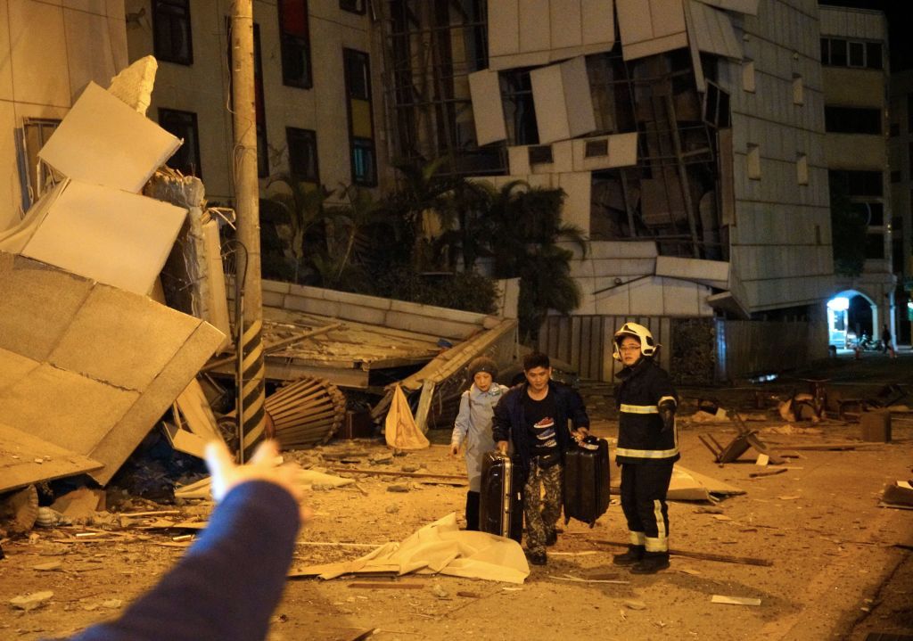 Guests evacuate a hotel in Taiwan.