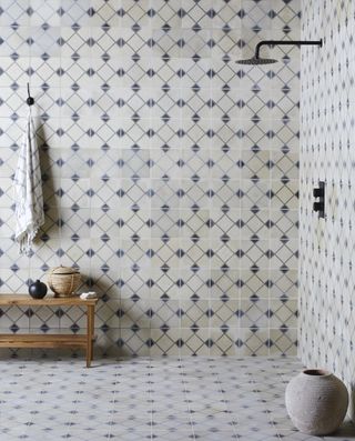 shower storage ideas towel hooks in printed tile bathroom by Bert & May