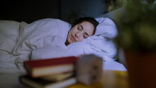 REM sleep: a person asleep in bed