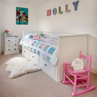 childrens room with bed and chair
