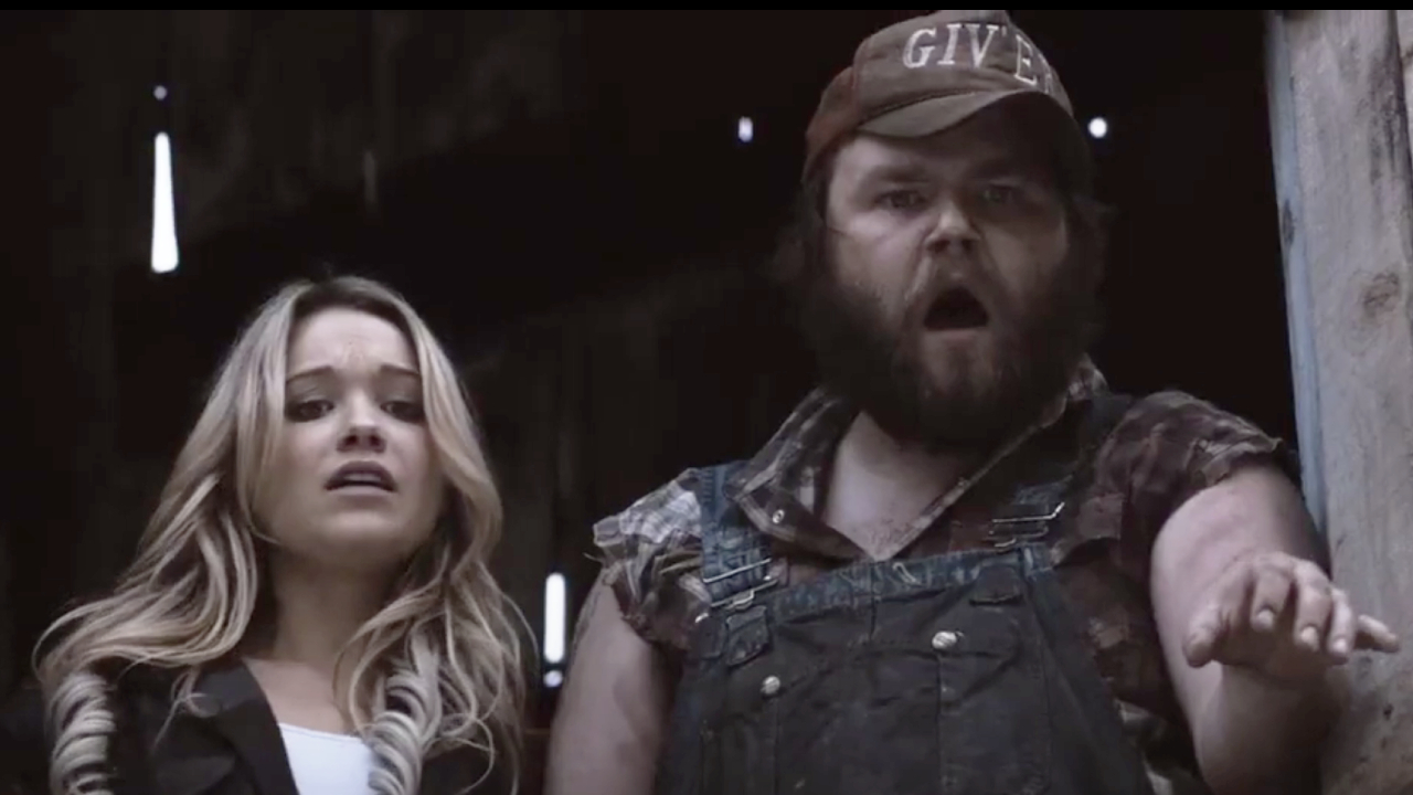 Katrina Bowden and Tyler Labine looking shocked in Tucker and Dale vs. Evil