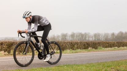 cyclist in aero position in saddle