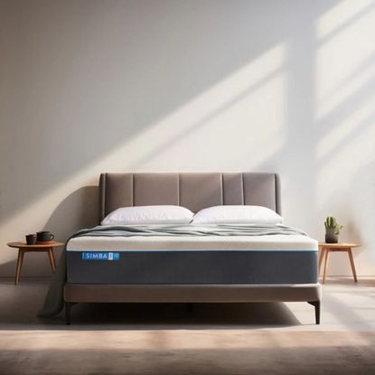 The Simba Hybrid Pro mattress on a bed in an empty room