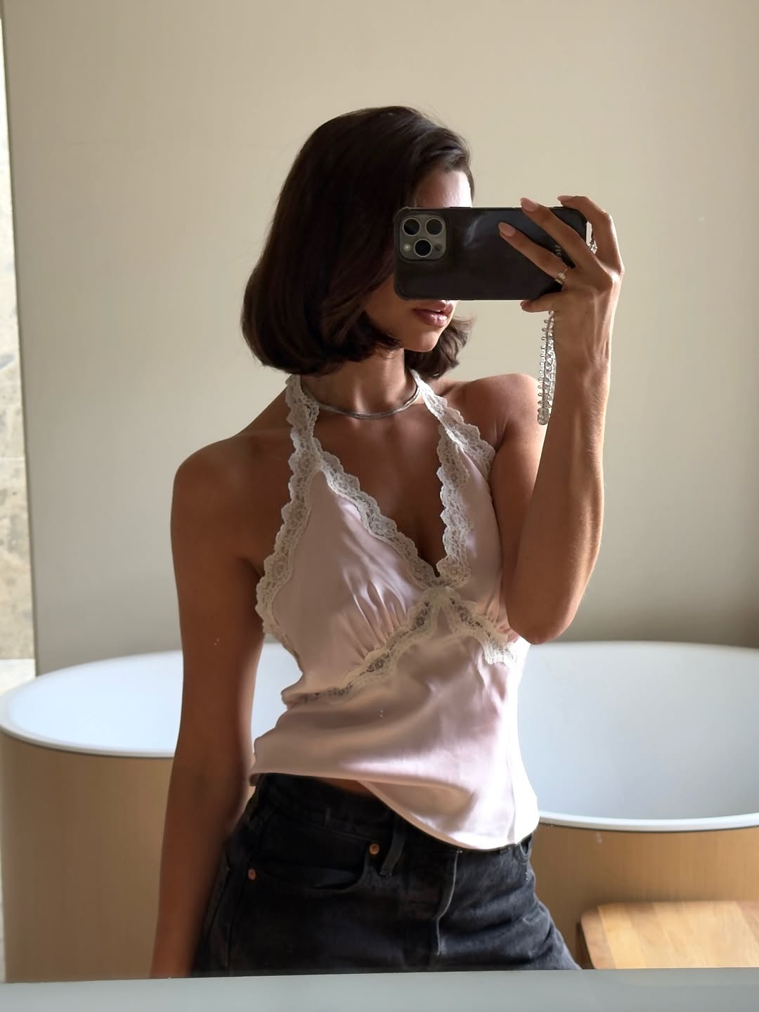 An image of a woman wearing timeless summer outfit