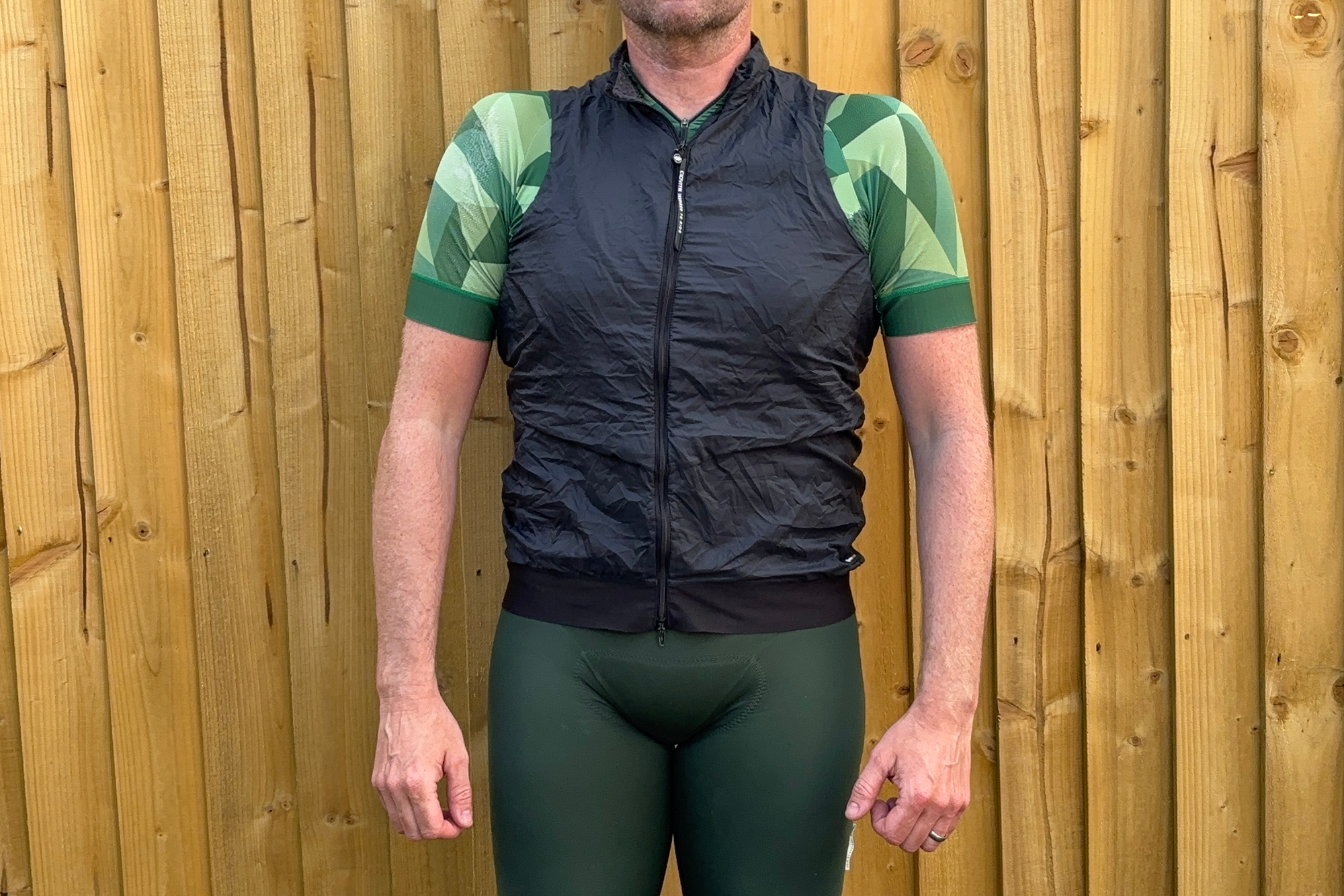 A male cyclist wearing a Ciovita gilet
