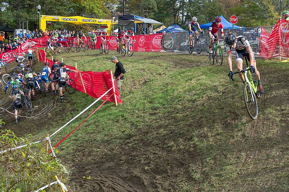 Spencer Petrov (USA) and the contendors lead the field as most other riders try to sort themselves on this twisted portion of the course during the junior men's race