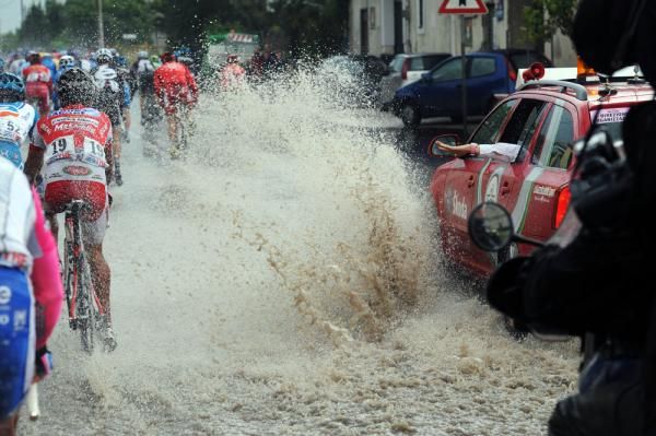 Sorry! A wave from the race vehicle probably wasn't fair compensation for this Acqua &amp; Sapone rider