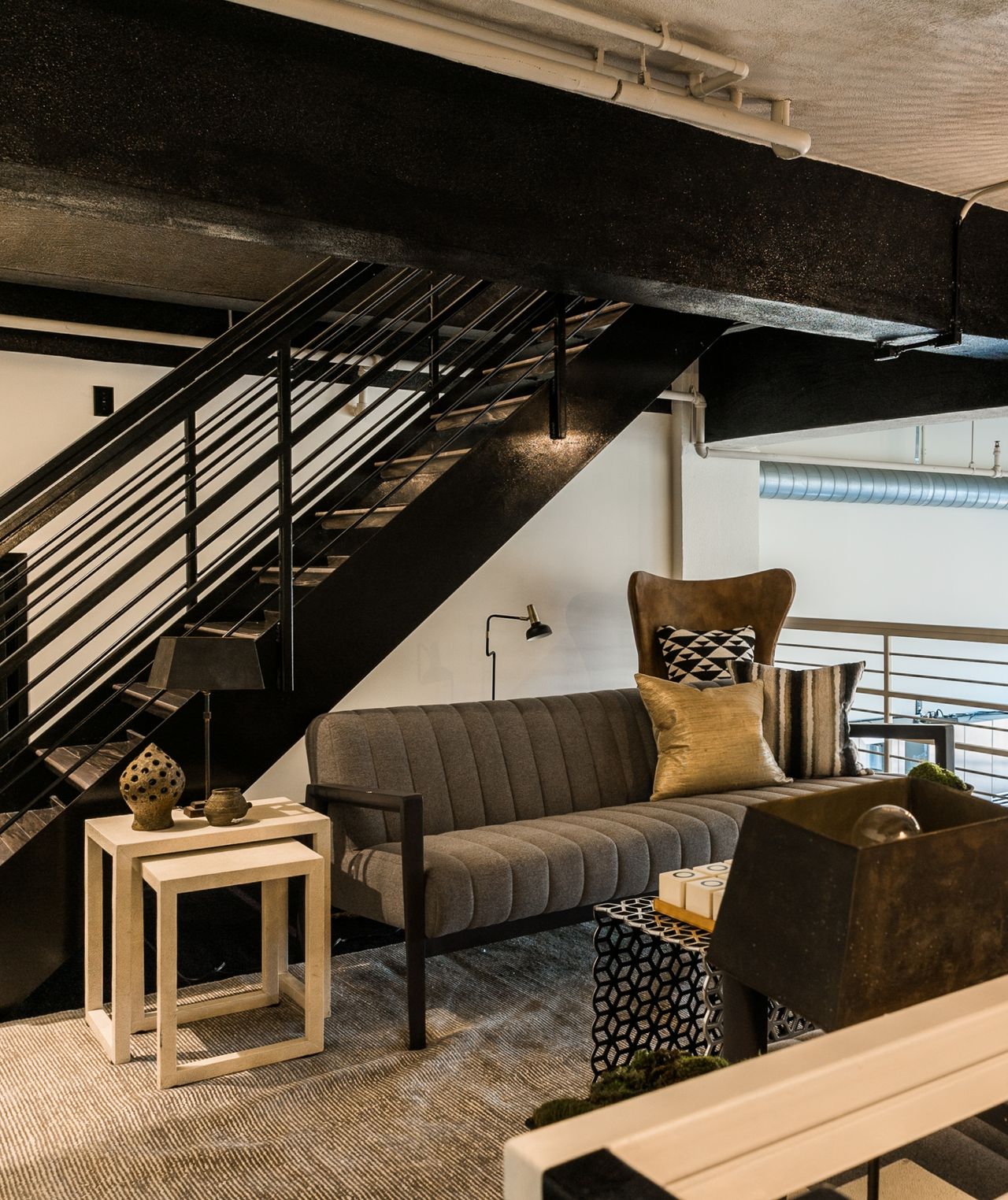 Sitting area on landing with gray chairs