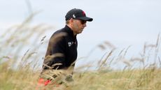 Sergio Garcia walks in the rough at Open Final Qualifying