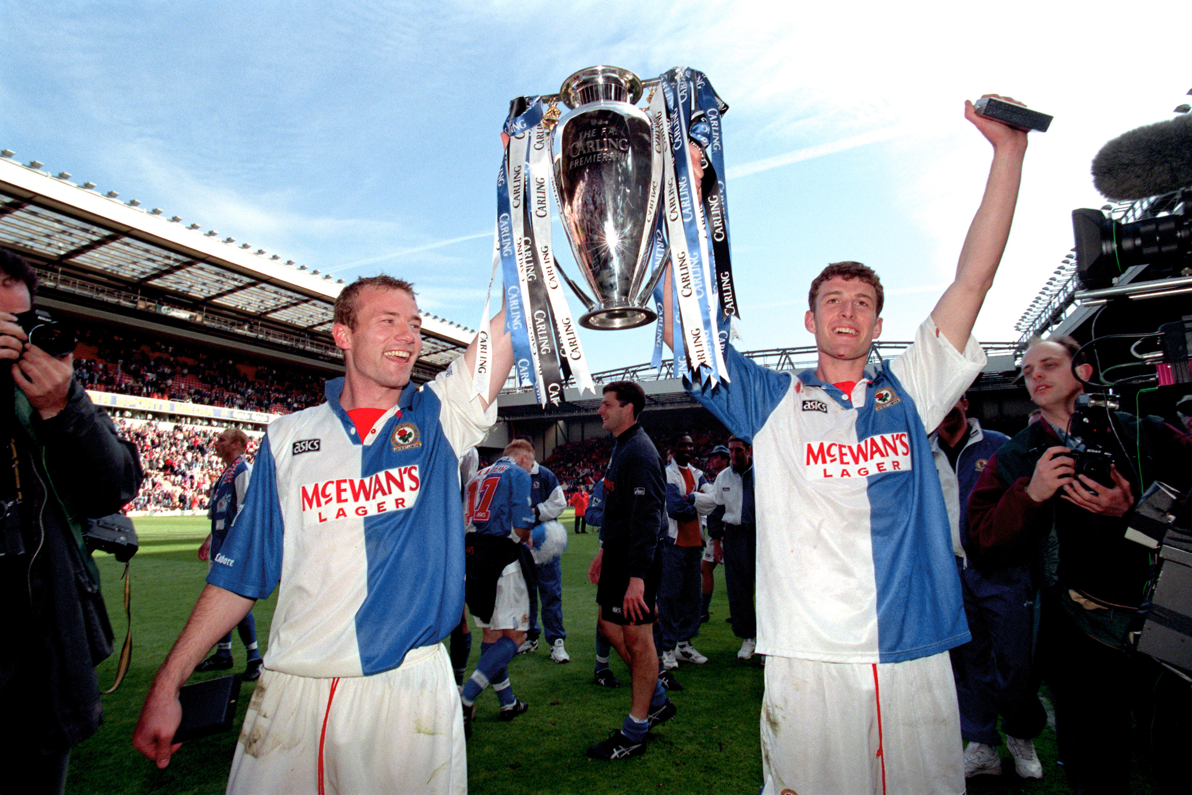 Blackburn Rovers' Alan Shearer and Chris Sutton celebrate with the Premier League trophy, May 1995