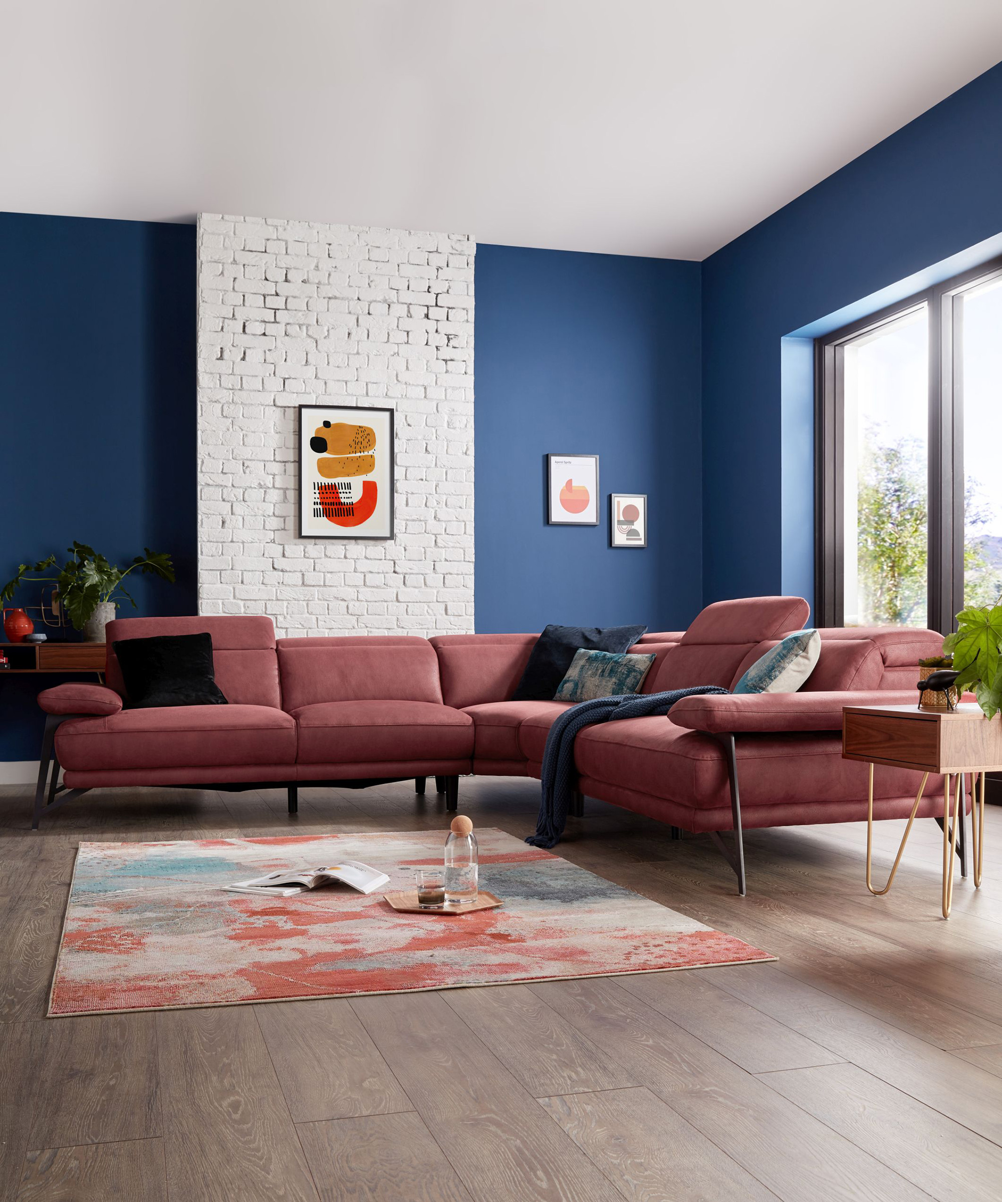 A blue living room paint color idea with exposed brick white wall by Sofology