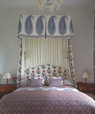 double bed with lots of pattern and canopy