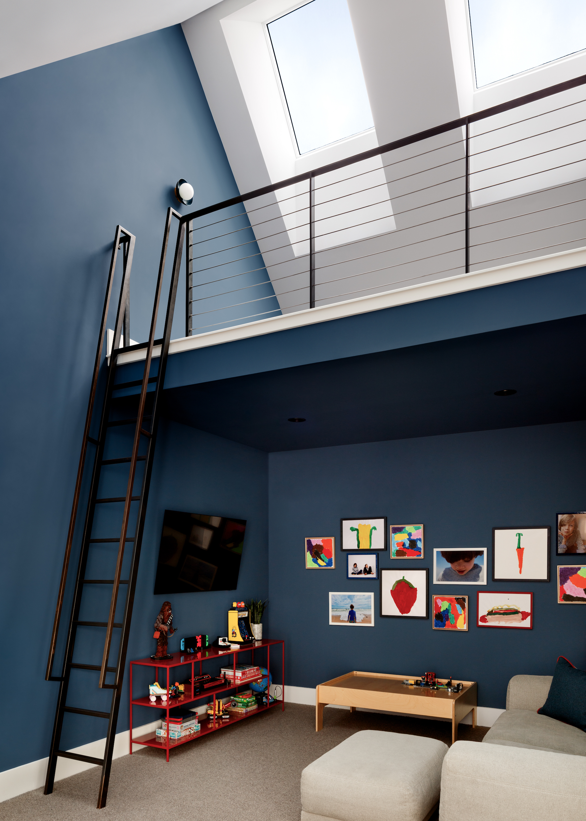 loft conversion with mezzanine level and toys beneath