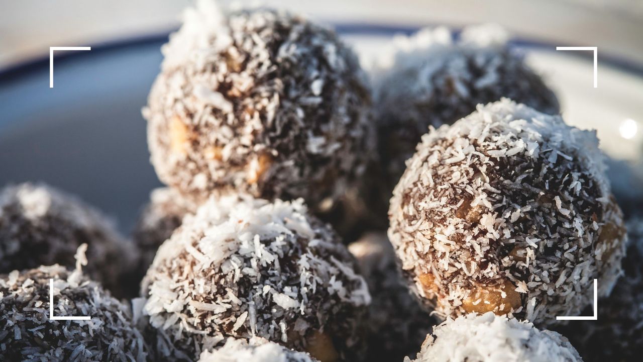 A bowl of fat bombs made with coconut and chocolate flakes