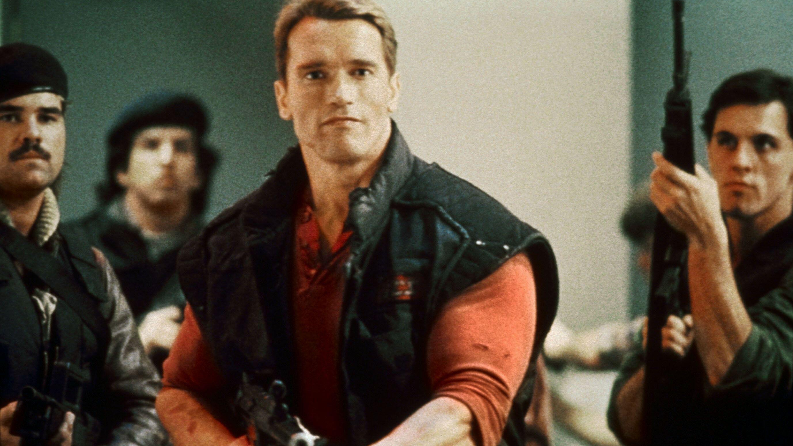 Ben Richards (Arnold Schwarzenegger) fires a rifle in a scene from &quot;The Running Man&quot;