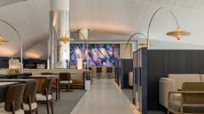 A spacious lounge interior at Incheon International Airport combines contemporary furnishings, natural textures and distinct areas for dining, work and relaxation