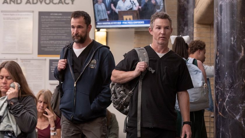Noah Wyle and Shawn Hatosy walking into the pitt on The Pitt. 
