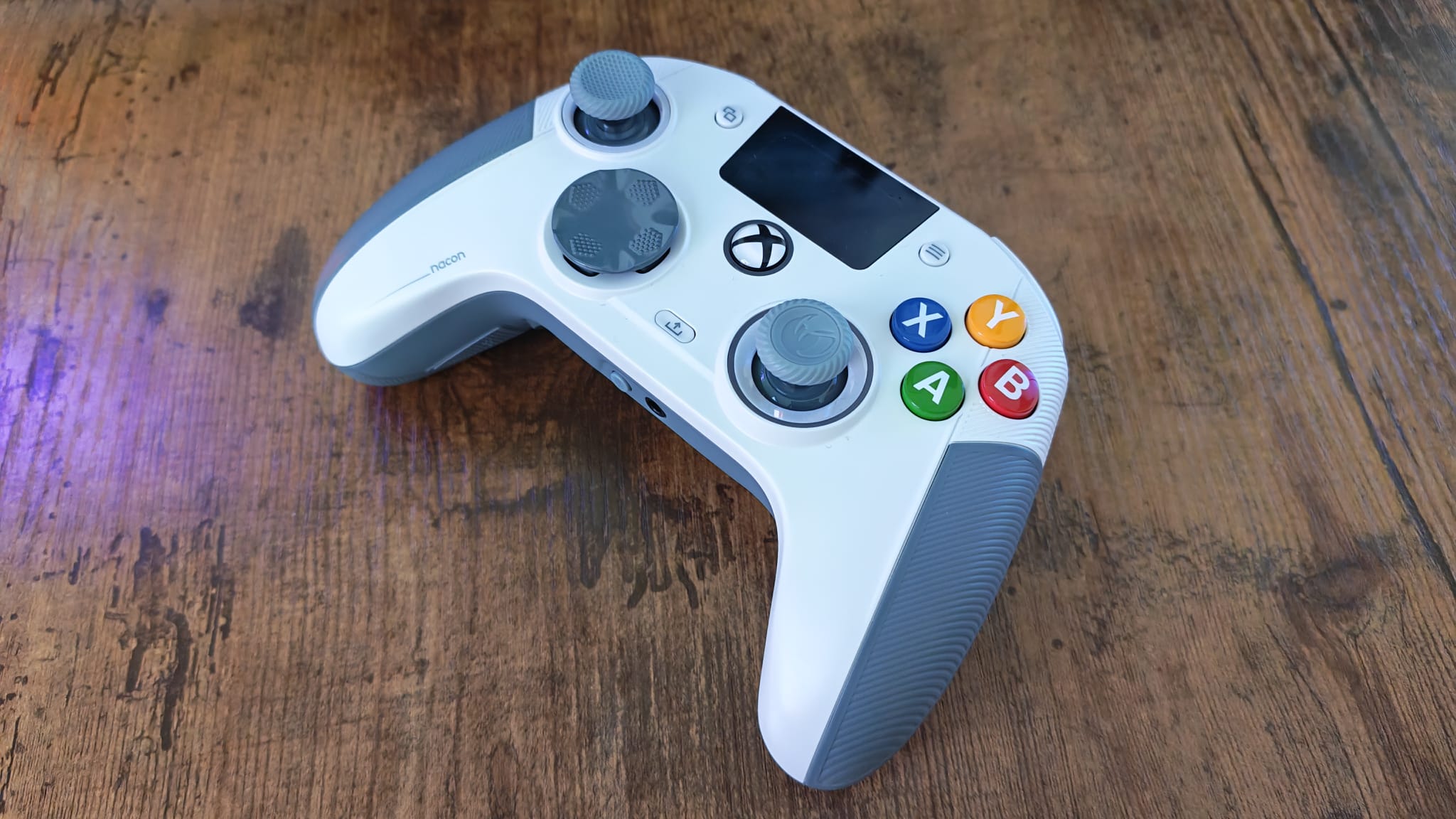 A Nacon RXU 360 Edition on a wooden desktop surface