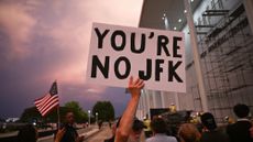 Protesters gather to watch President Donald Trump's name removed from Kennedy Center