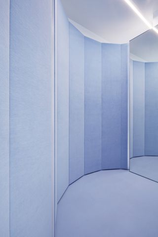 A blue wall in Filippa K Amsterdam boutique