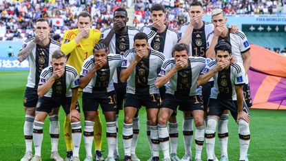 Germany players covered their mouths in protest before their match against Japan 