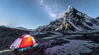 how to choose a backpacking tent: camping beneath a mountain summit