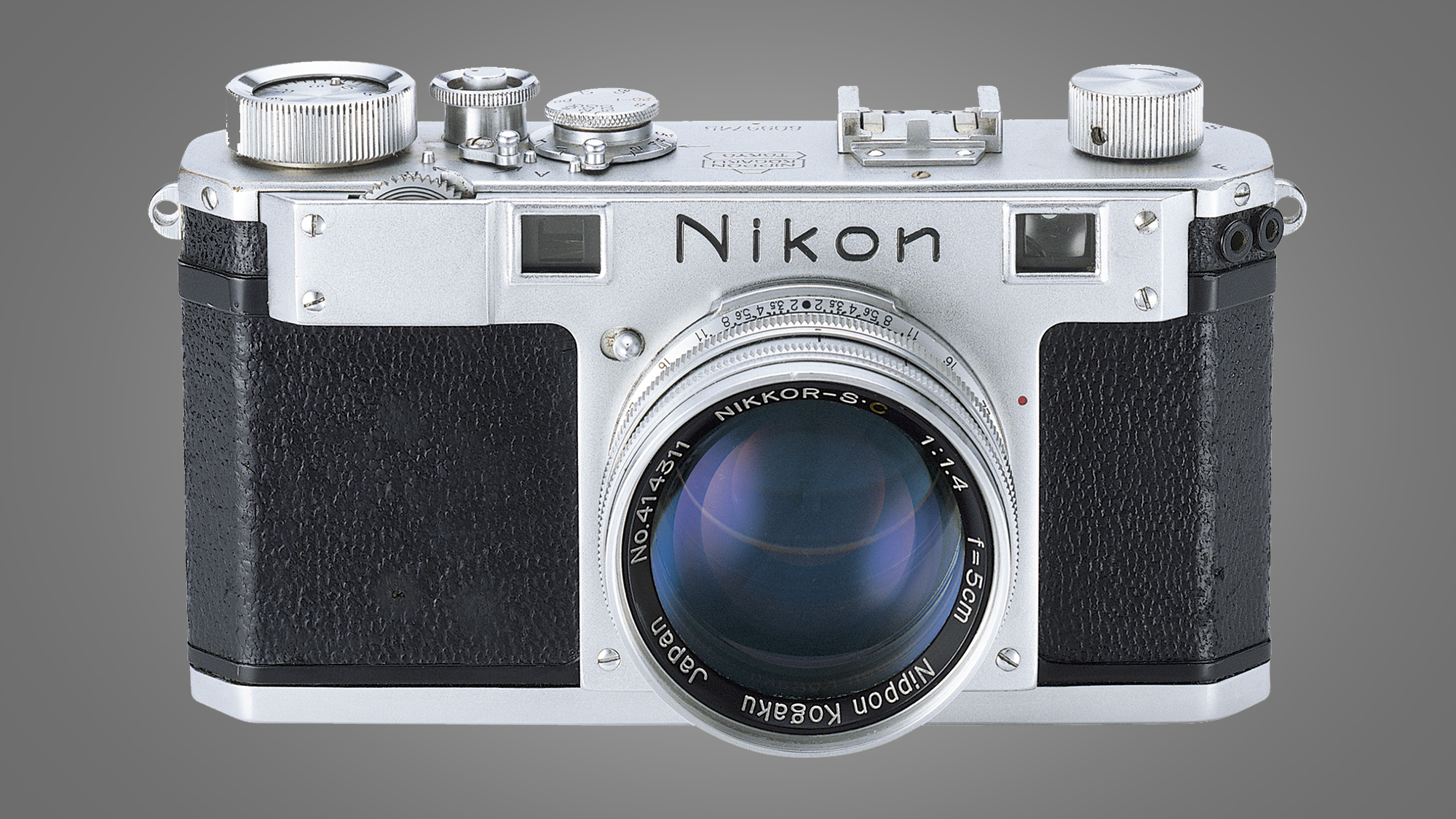 The NIkon S camera on a grey background