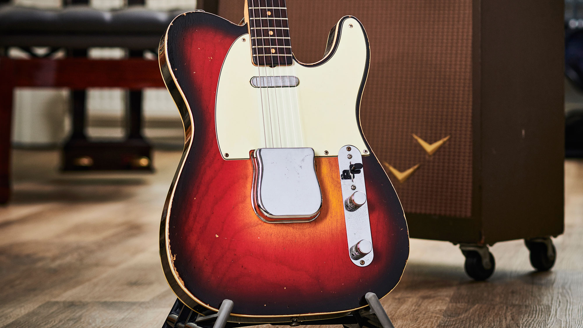 Fender Custom Shop Jaguar and Telecaster in front of a wall of amps