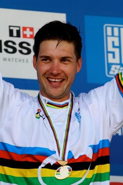 Greg Minaar pulls on the rainbow jersey as 2012 World Champion