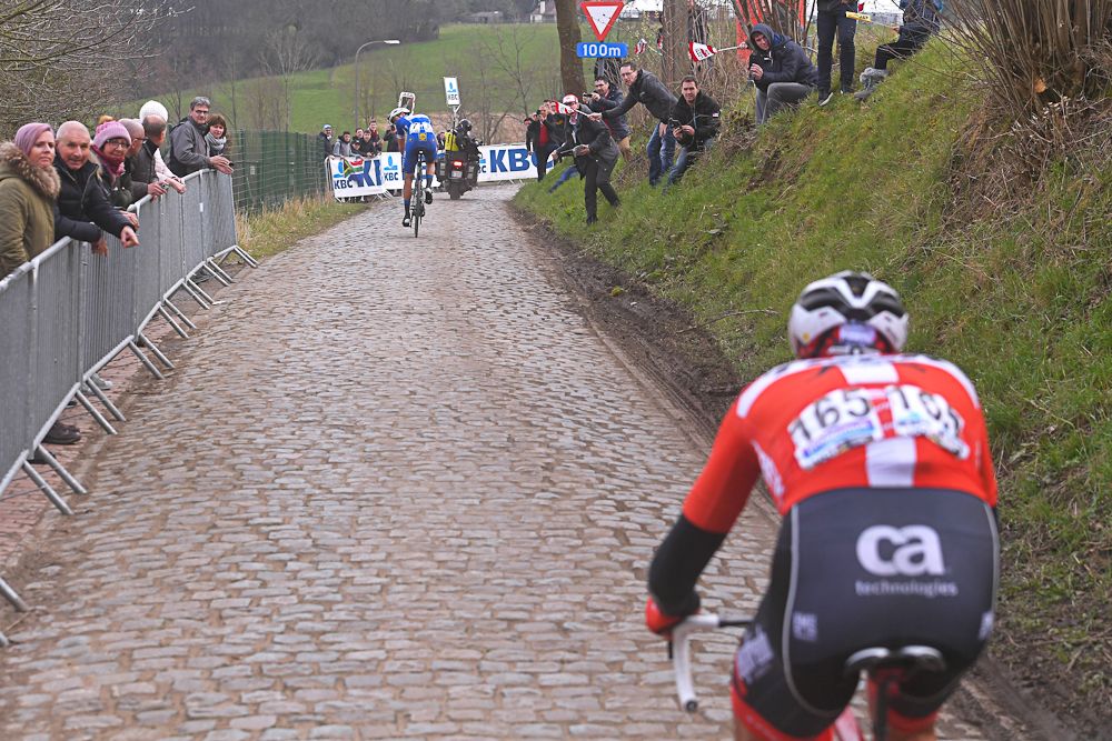 Niki Terpstra checks back for Mads Pedersen near the end of the Tour of Flanders