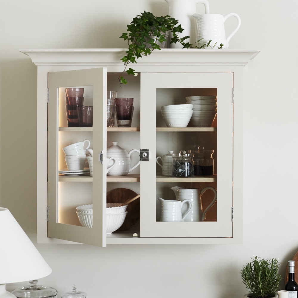 white kitchen cabinet with kitchenware