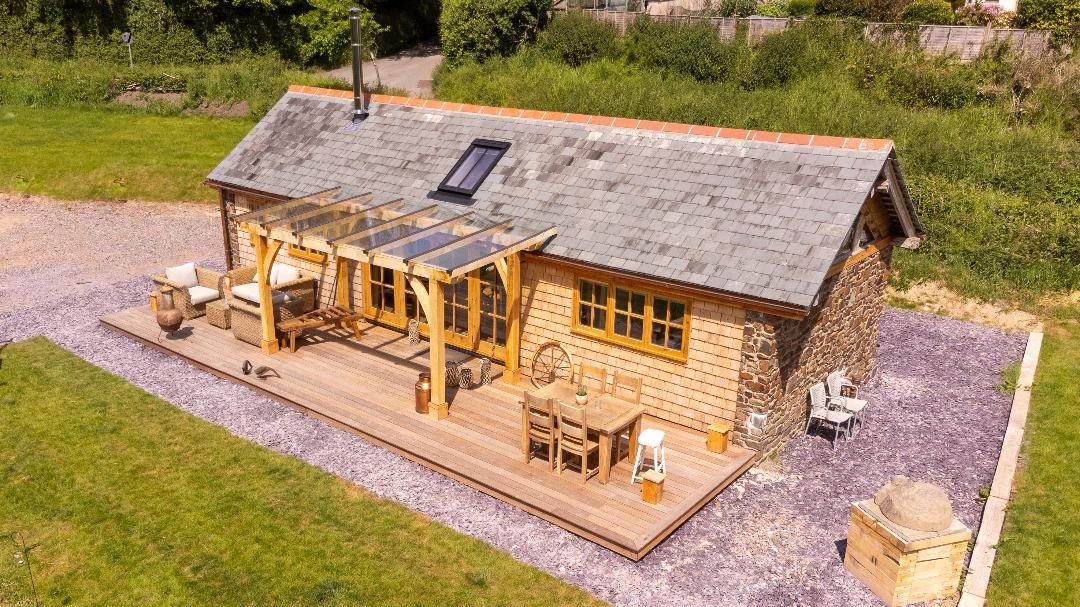exterior of log cabin with outdoor patio area