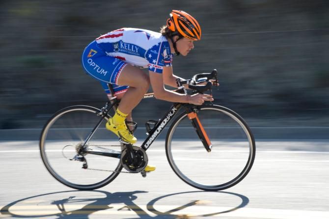 Jade Wilcoxson shows off her national championship kit as she flies down a descent.