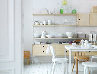 Modular kitchen storage in a modern scandi kitchen with pale wood cabinets