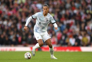 Virgil van Dijk of Liverpool runs with the ball during the Premier League match between Arsenal FC and Liverpool FC at Emirates Stadium on October 09, 2022 in London, England.